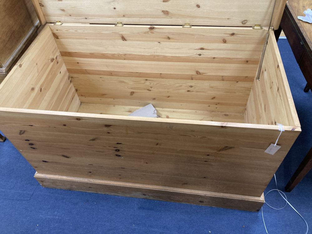 A large Victorian style pitch pine trunk, width 131cm depth 70cm height 74cm